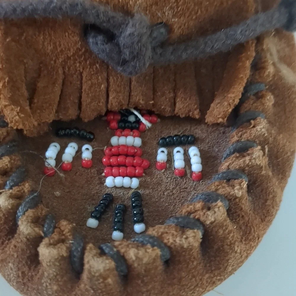 Minnetonka beaded thunderbird slip on Moccasin